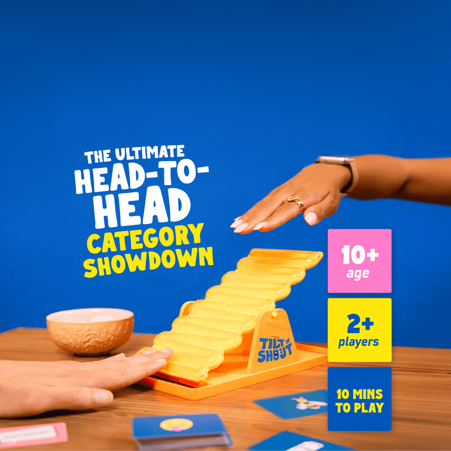 Two hands on the Tilt n Shout seesaw. The text reads 'THE ULTIMATE HEAD-TO-HEAD CATEGORY SHOWDOWN' and includes 10+ age, 2+ player, and 10 mins playtime callouts.
