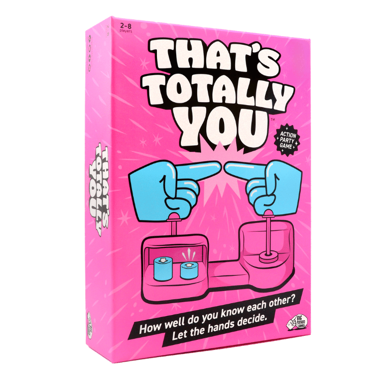 'That's Totally You' party game box, featuring a bright pink cover with bold white and black text, blue cartoon hands pointing inward.